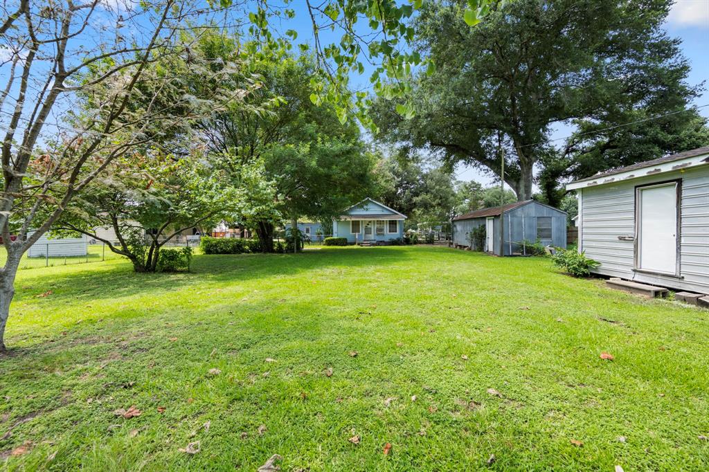 At back of property on western edge of the lot is a building that was added as additional living quarters for a parent.