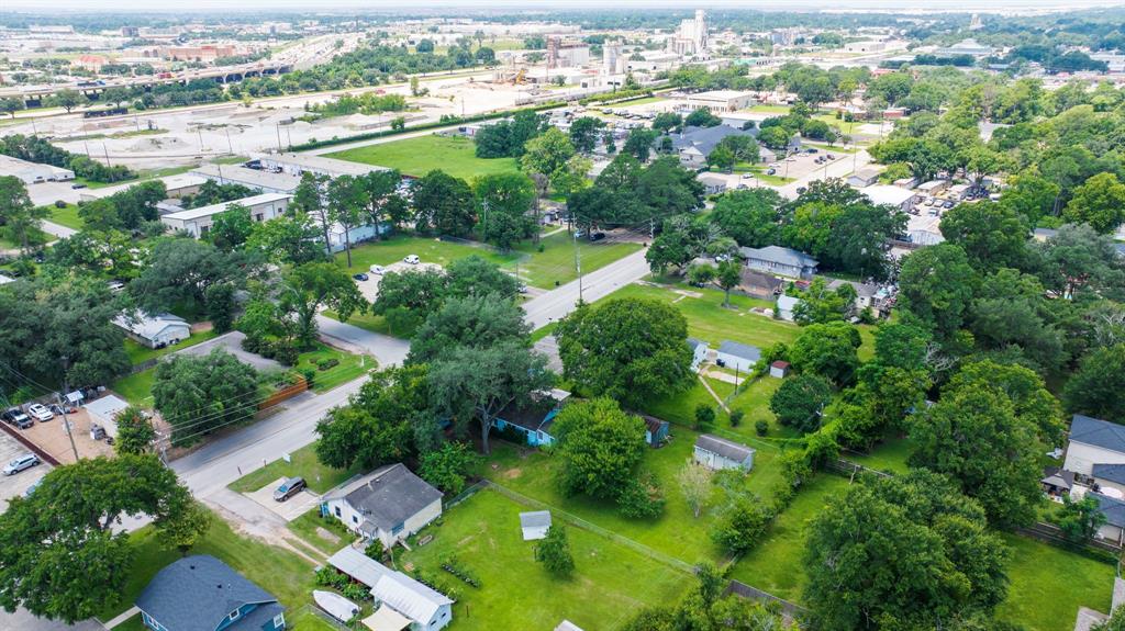 More aerial views with iconic rice dryers in background and views of Interstate 10.