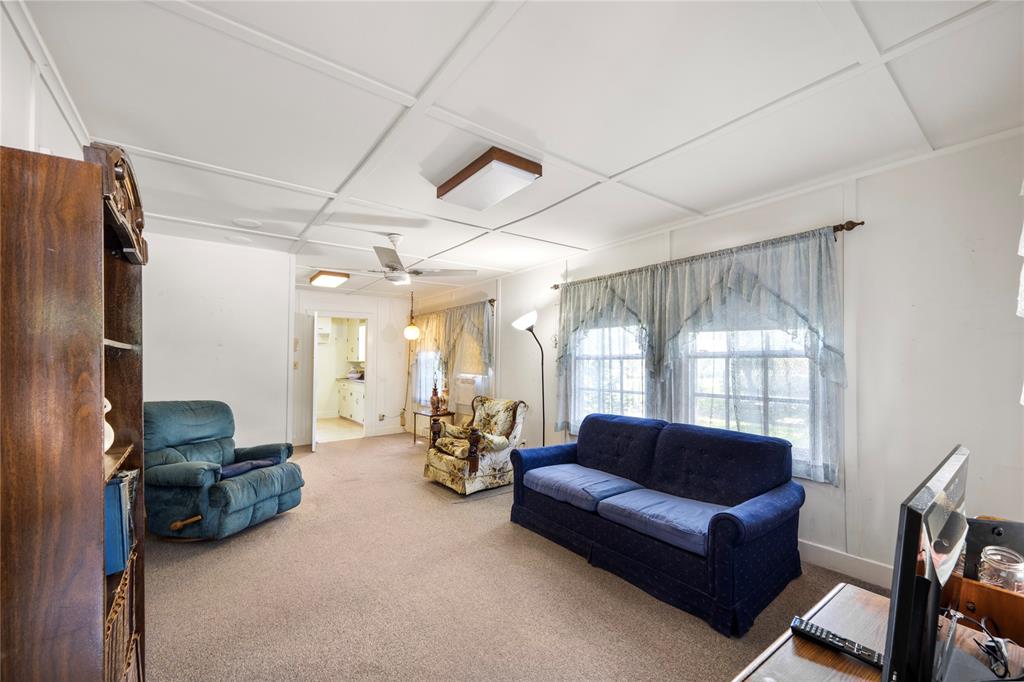 View of living/dining room as you enter the home from front. This house was an original Humble Gas plant house built in 1945 and relocated to this site.  It has been continuously lived in since 1970 by family.