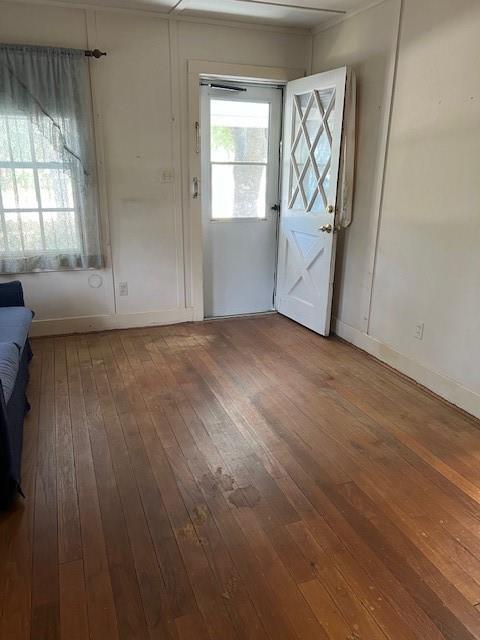 View of the wood flooring in living space original to home and in good condition.