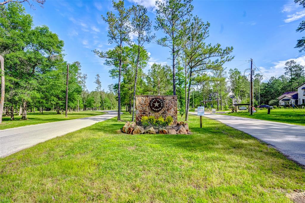 The ideal location with nearby towns of The Woodlands, New Waverly, and Conroe allow for the country charm while still providing the convenience of city living with low tax rate, no MUD tax and low HOA dues!