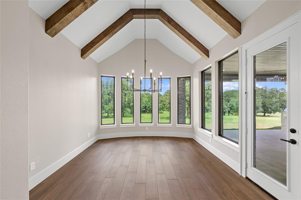 View of the kitchen looking into the living space. Notice a door inside the dining room that also leads out into your covered backyard patio and built-in summer kitchen.