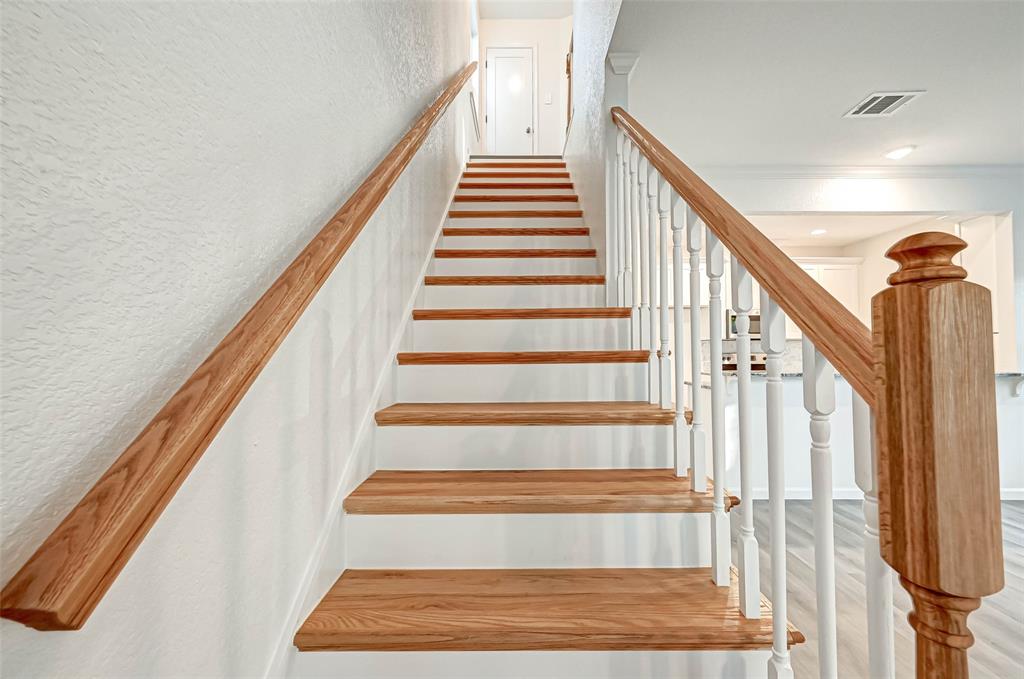 Head up the stairs that have Gorgeous Wood hand rails and steps.