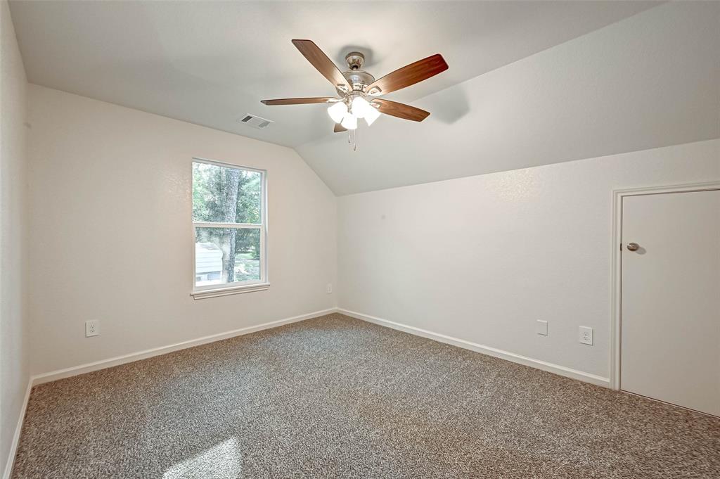 Secondary Bedroom upstairs with attic access.