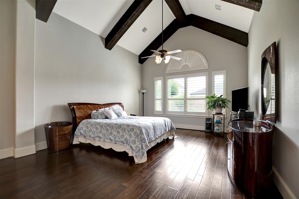 High Ceilings with wood beams in Primary