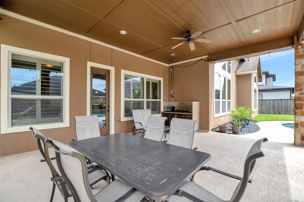 Large covered patio with outdoor kitchen