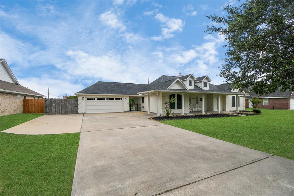 Extended driveway on side of home for extra parking, RV, trailer, etc.