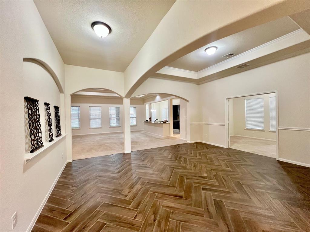 Off of the dining room area are french doors that lead to a play room or office.