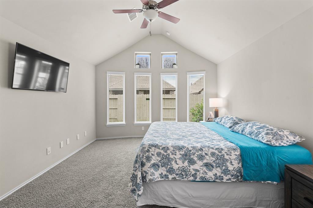 Primary bedroom brings in so much natural lighting! Bay window makes for a great seating area!