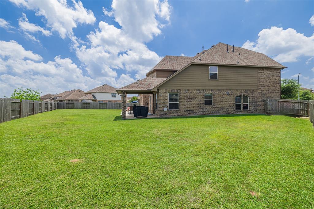 The expansive backyard is perfect for a pool and entertaining.