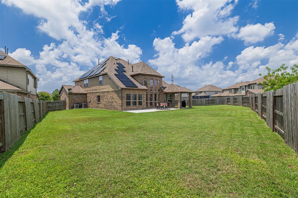 The expansive backyard is perfect for a pool and entertaining.