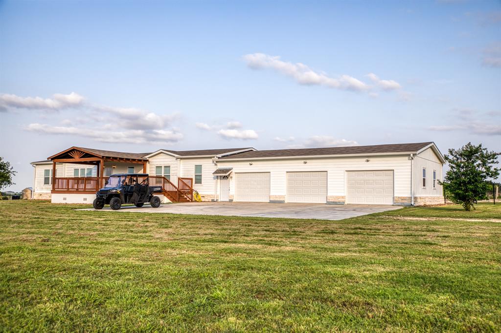 This Texas-sized expansive three-car garage is designed to accommodate all your vehicles and equipment, providing both practicality and efficiency.