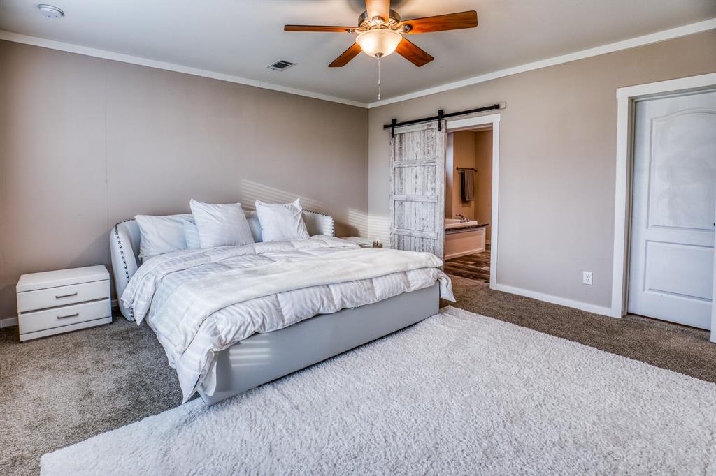 Retreat to the serene master bedroom, where neutral tones and soft textures create a peaceful ambiance.