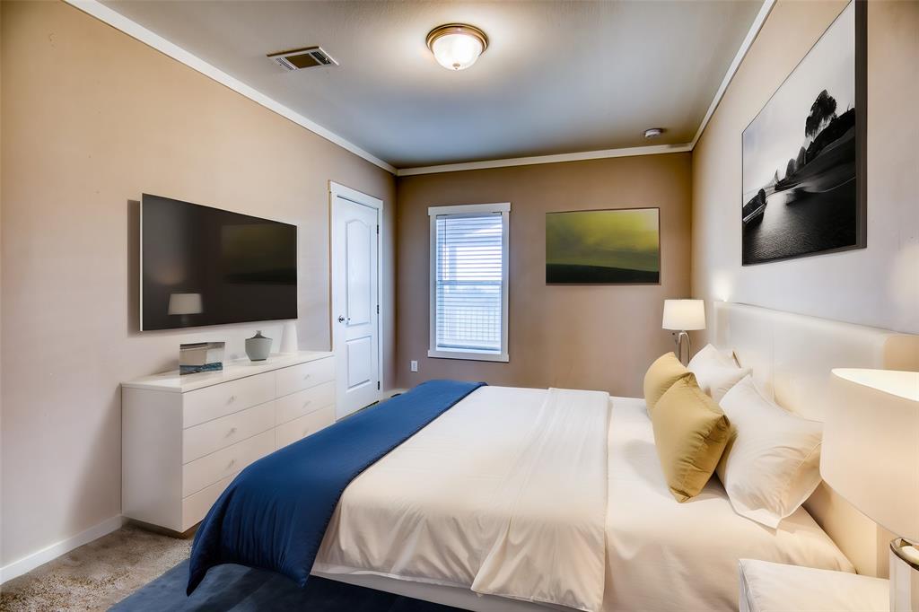 Welcome guests with comfort and style in this inviting guest bedroom. Neutral tones, cozy linens, and modern furnishings ensure a relaxing stay for family and friends.