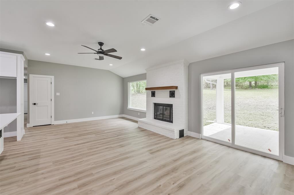 Tons of natural light from the huge picture window and sliding glass doors! Enjoy the beautiful fireplace as well!