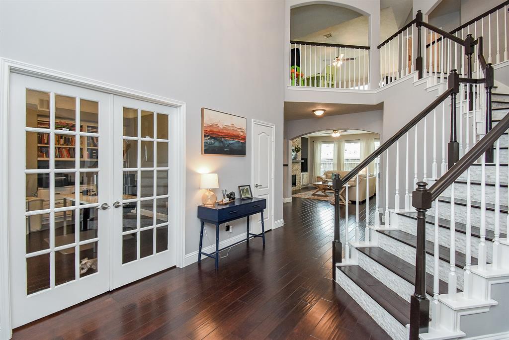 Think Dickens or Downton Abbey charm in this magazine worthy view; including classic french doors, left, leading to a wonderful home office/study.