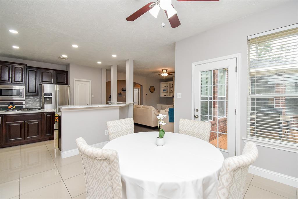 This cozy breakfast/casual dining nook invites good sized pieces and accents; all overlooking patio/backyard. Wide open airy space links popular common areas, with ease.