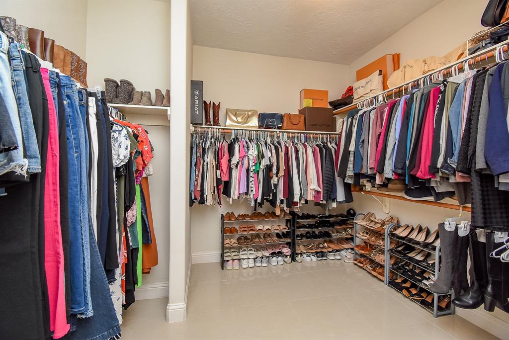 One can never have too many closets! This primary ensuite walk-in, however, beats all!