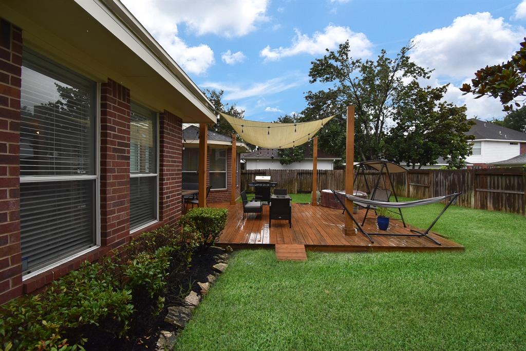 Isn\'t this scene the epitome of easy luxury on a huge patio/porch, all surrounded by privacy fencing and a lush carpet of green?