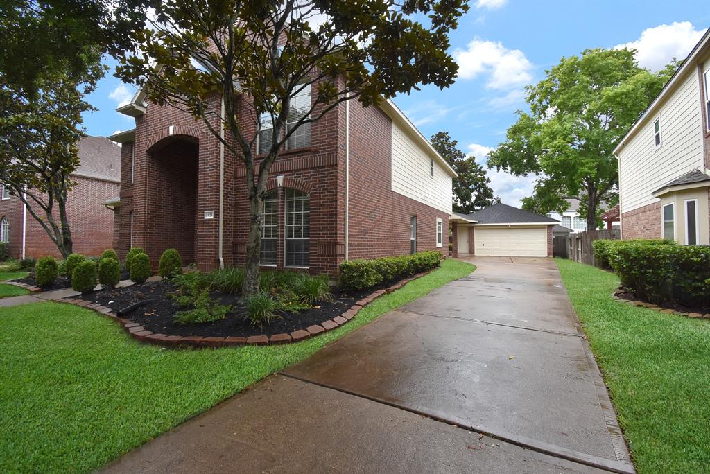 Impeccably maintained, inside and out, this special residence features a detached garage/carport and this long welcoming driveway, perfect for visiting guests.