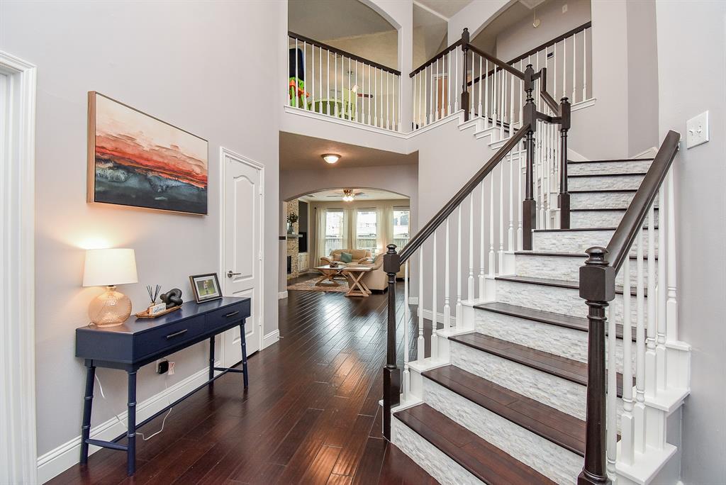 The spectacular angled stairway presents a warm welcome; with a clear open view of your beautiful living/family room straight ahead.