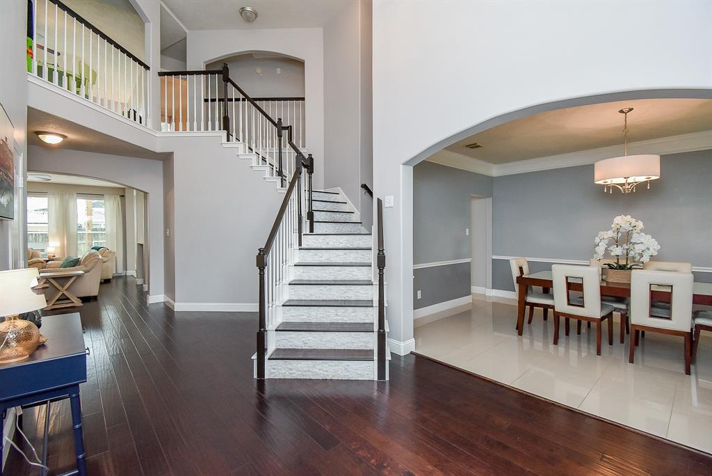 The timeless beauty and versatility of the truly workable open floor plan design concept is clearly appreciated in this view of unobstructed airy space, with a view of your amazing formal dining space, right which can be as private or open as you wish!