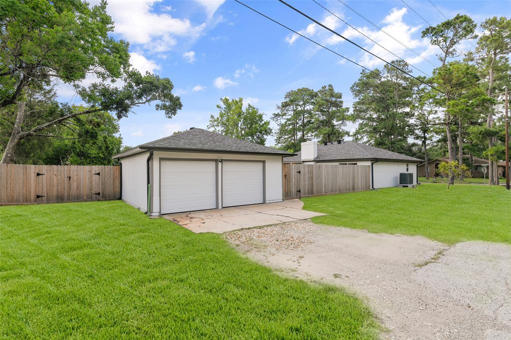 Two car detached garage with boat or additional parking featuring a double gate to rear yard ~ SEE AMENITIES LIST ONLINE, WAY TOO MANY UPGRADES & UPDATES TO MENTION HERE!