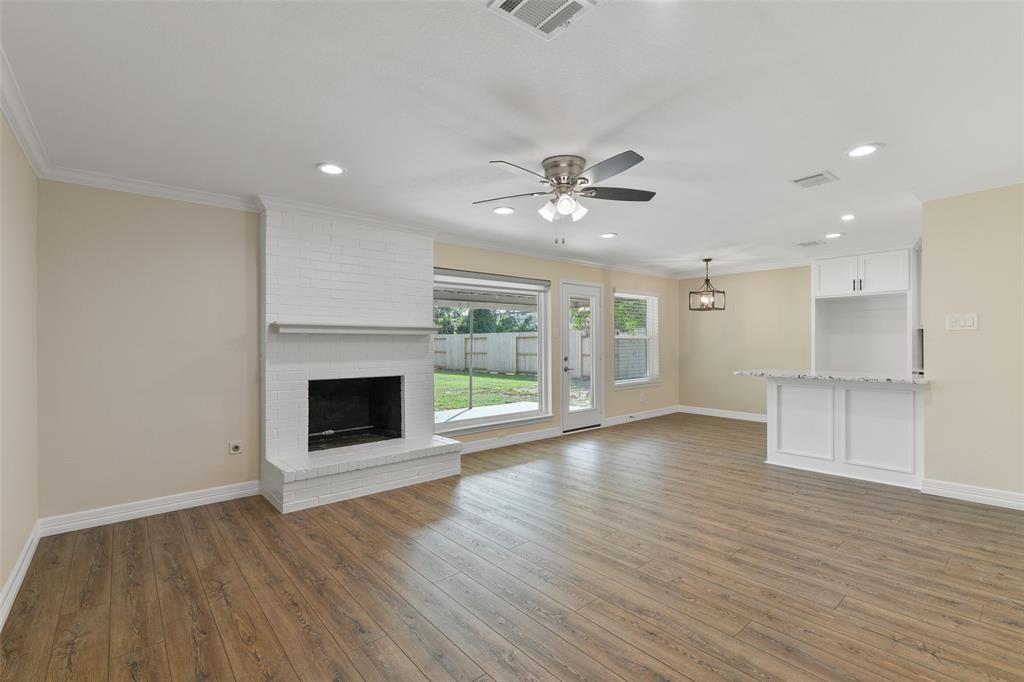 Large family room featuring a wood burning or gas burning fireplace ~ SEE AMENITIES LIST ONLINE, WAY TOO MANY UPGRADES & UPDATES TO MENTION HERE!