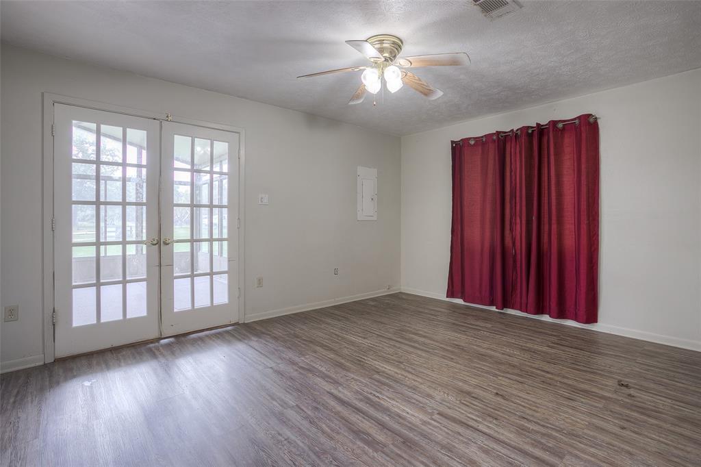 Double doors to sunroom off primary bedroom