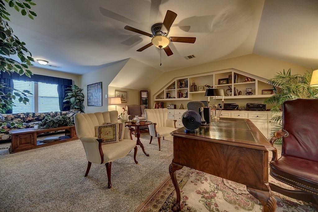 The home office on the upper floor is grand in size and style and could easily be a gameroom or sixth bedroom. There is a closet to the left of this perspective.