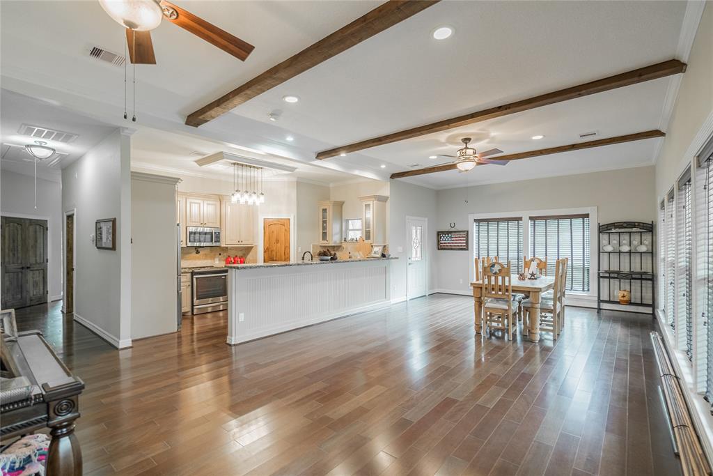 From this view, you can see the kitchen and very large space for the dining room. Large enough to hold your many guests who will be coming out to see \