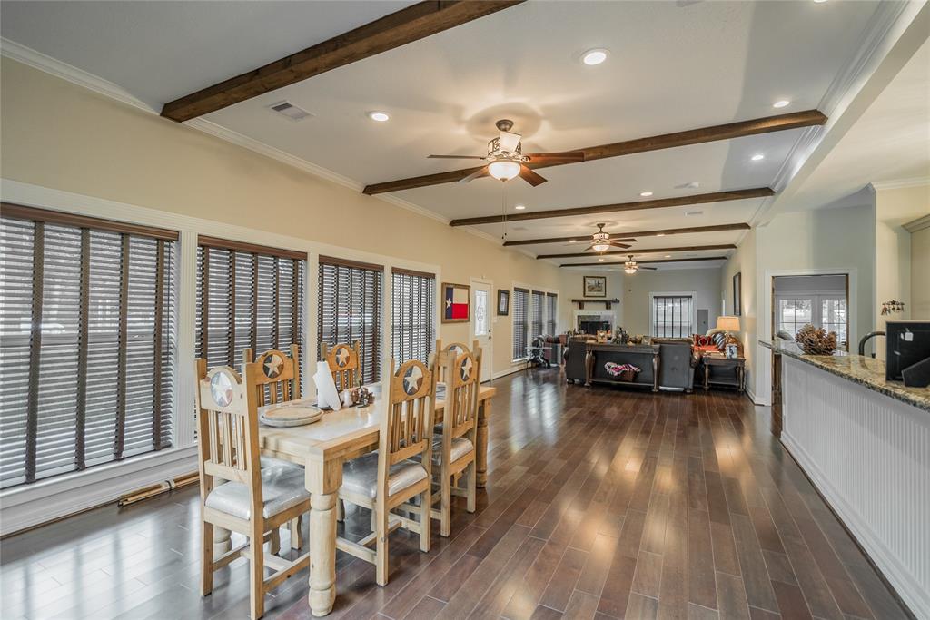 You will notice that the bar can seat many stools for your guests, and a pool table can easily fit between the living and dining areas.