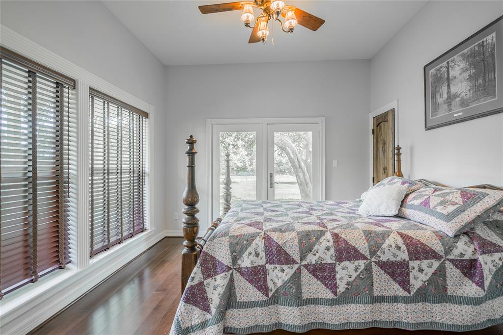 The second bedroom is equally as large, with french doors that lead out to the porch. It has a walk in closet, and lots of windows again to enjoy the view.