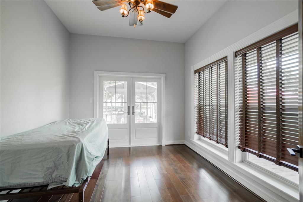 This is the third bedroom that is large as well, and has a french door leading out to the porch. Please notice again, the large windows and cherry wood floors.