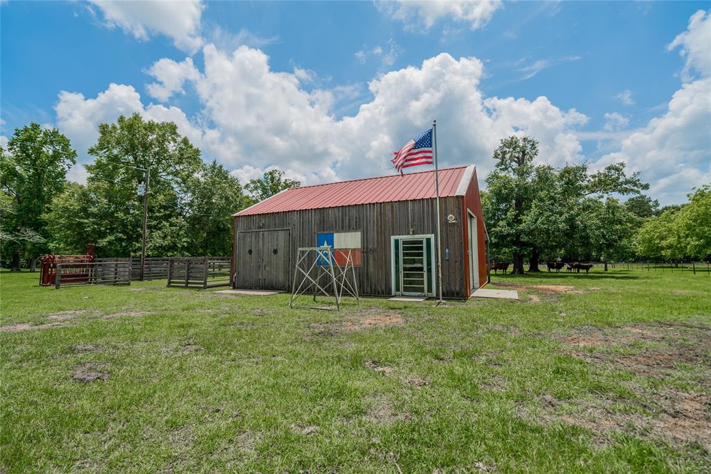 Cool looking barn w/ metal roof and extra doors for convenience.