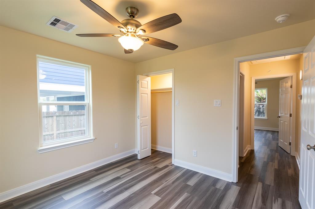 bedroom light and bright and large plenty of closet space  new ceiling fans