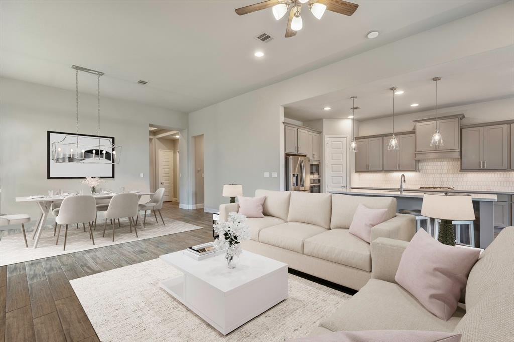 You and your guests will certainly dine in style in this amazing area! Featuring a modern chandelier, large windows, neutral paint, high ceilings, and beautiful flooring!