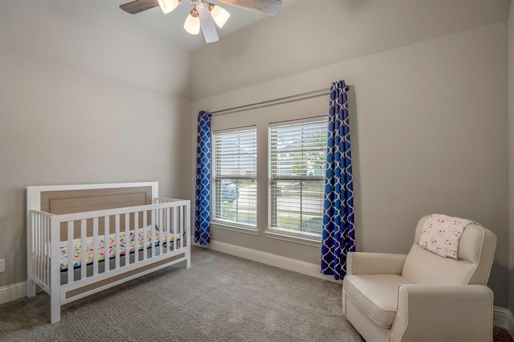 This full bathroom is located off the hall of the secondary bedrooms making it easy to share and get ready. It features a large vanity, gray cabinets, quartz countertops, and a large combination tub and shower in a separate space.