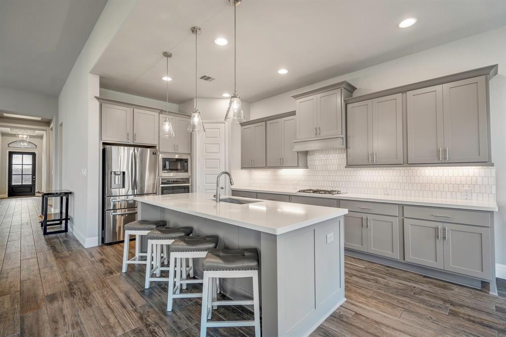 Your family and guests will enjoy many nights of fun, food, and entertainment with ample counter space and kitchen island for setting up a wonderful array of provisions!