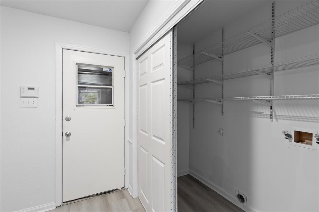 Laundry closet in home and garage access door.