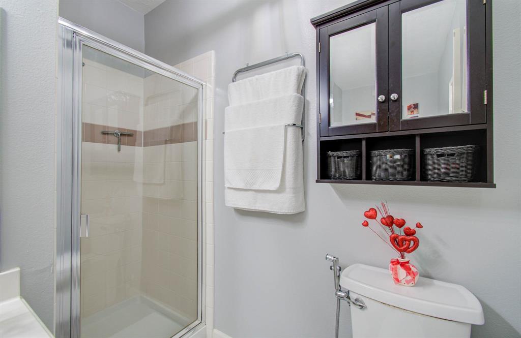 Offering a spacious shower and tile flooring