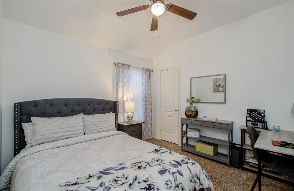 This bedroom offers storage and neutral tones