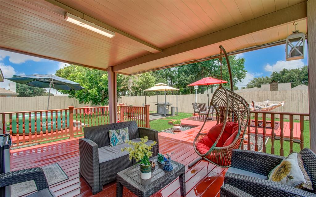 Step outside to discover a beautifully appointed back porch