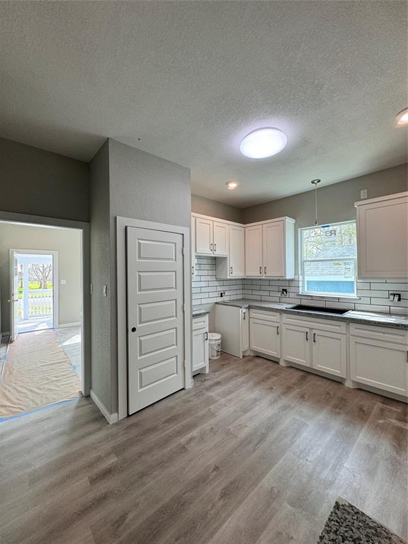 Wow, this is the mic drop! new everything, cabinets, granite counter-tops, subway tiled backsplash, sink, faucet is coming, window, lighting, added a pantry and a stove to come