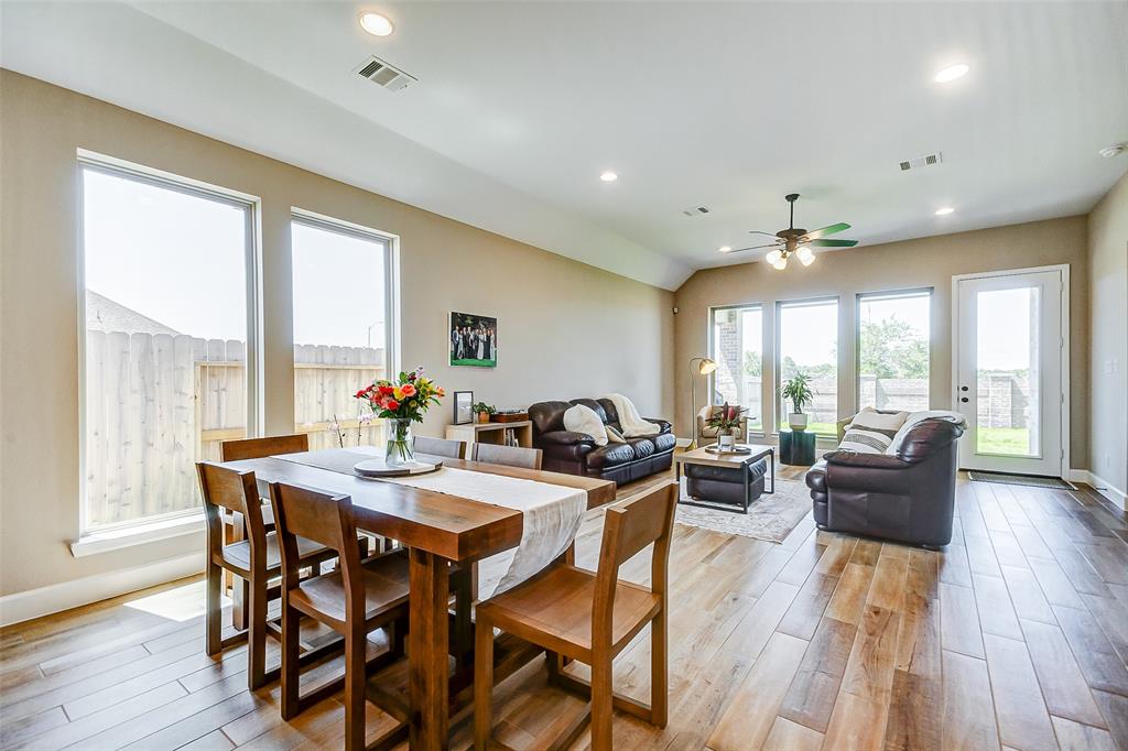 So much natural light, the light color floors and two tone paint that separates the ceilings from the walls make the room feel spacious and inviting.  The homeowners also upgraded the baseboards to 5\