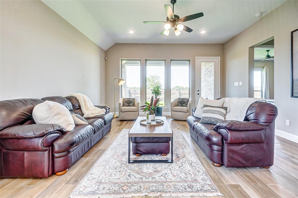 The living area with space for plenty of seating overlooks the back patio and yard.