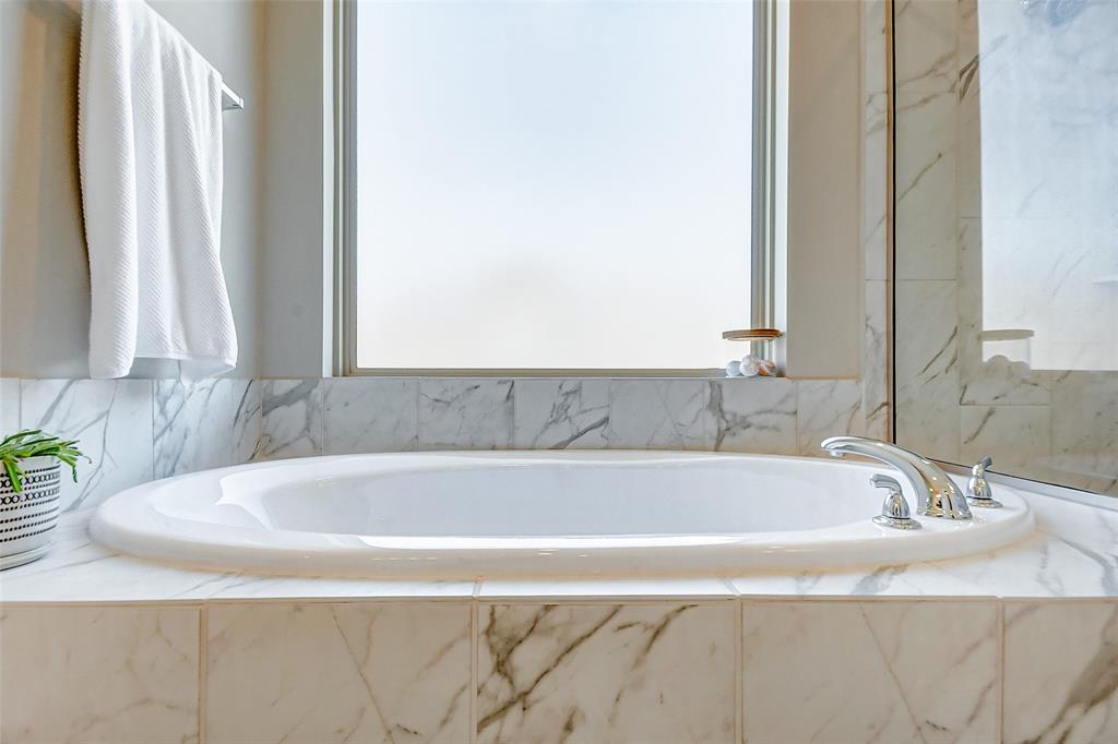 The soaking tub and oversized shower is the perfect place to unwind after a long day!