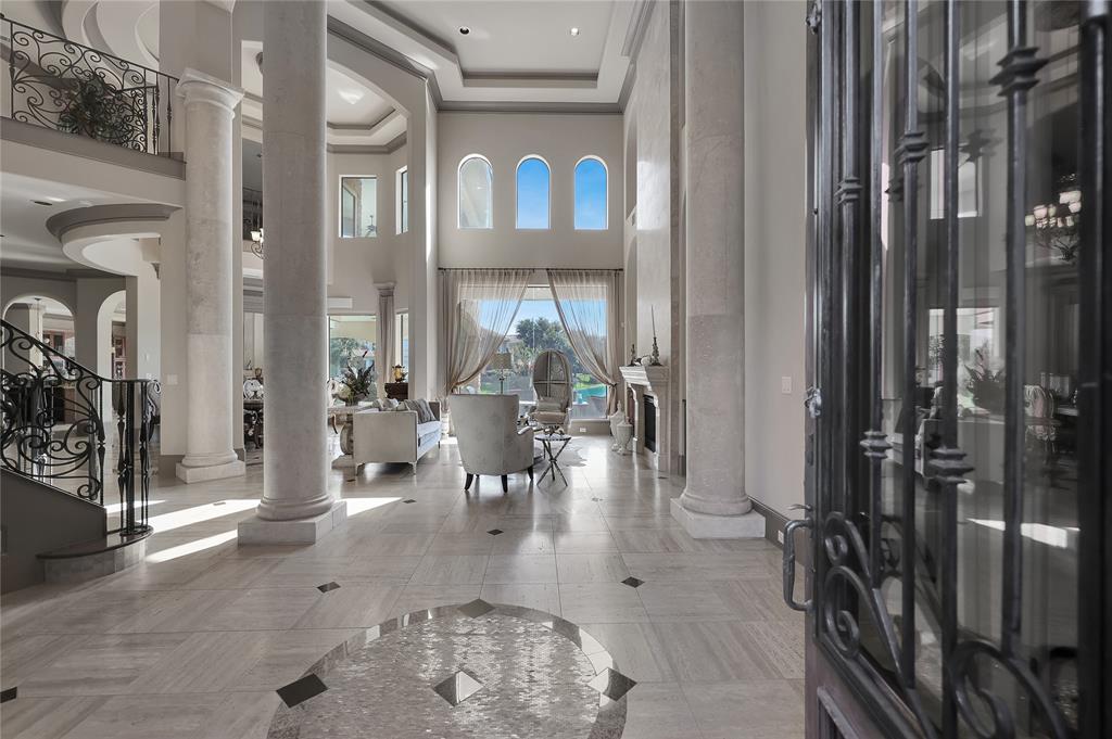 Welcome to your new home through the Formal Foyer with travertine flooring, two-story ceilings, and a wonderful inviting area for all to enjoy at each time of entry.