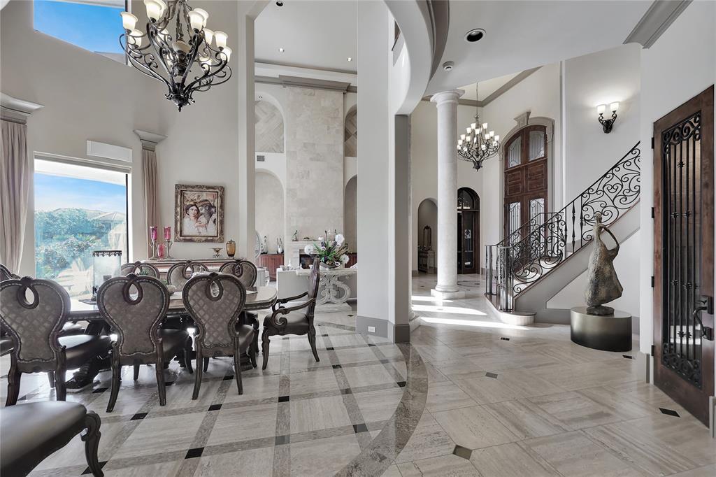 Another view of the Dedicated Dining Room and the space it has to offer with a Lake View, Two Story ceilings, and more to enjoy.