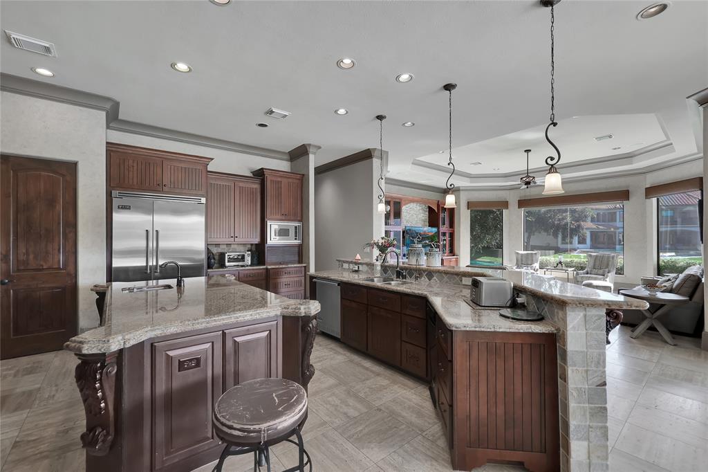 The Gourmet Kitchen boasts Granite Counter Tops, Butler\'s Pantry/Wet bar, Lake View & Wine Room to enjoy creating memories while preparing meals!